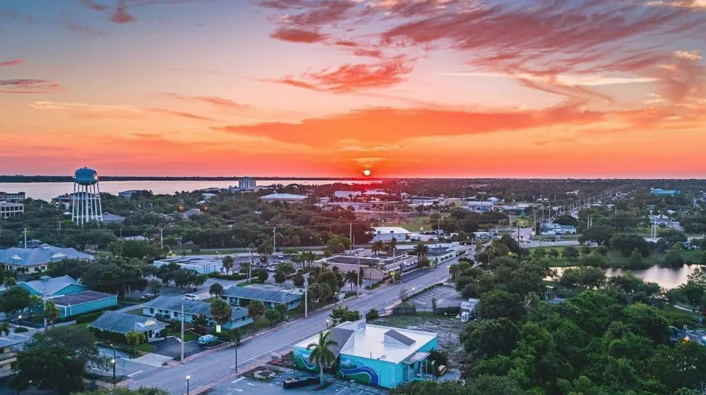 A low-rise Treasure Coast town at sunset, seen from above