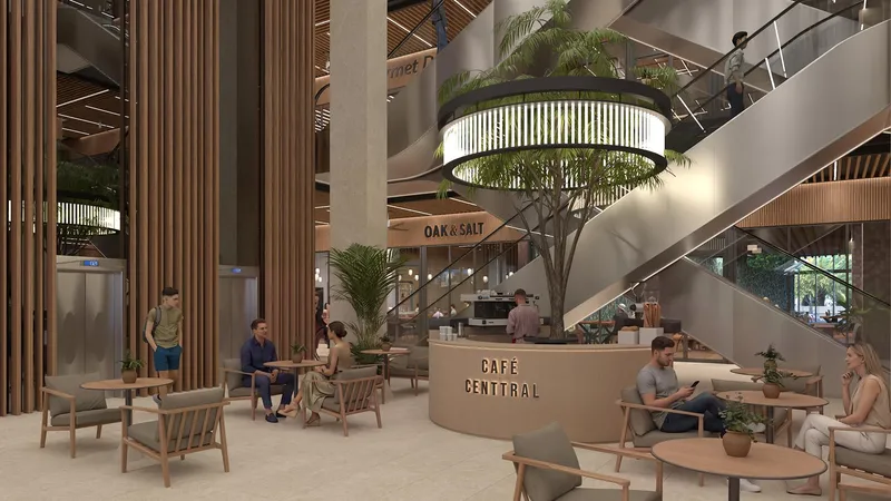 Rendering of the atrium at Centtral Aventura: a café counter under crossing escalators