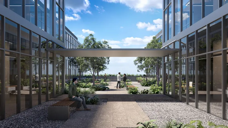 Rendering of the office courtyard at Centtral Aventura looking between the glass towers