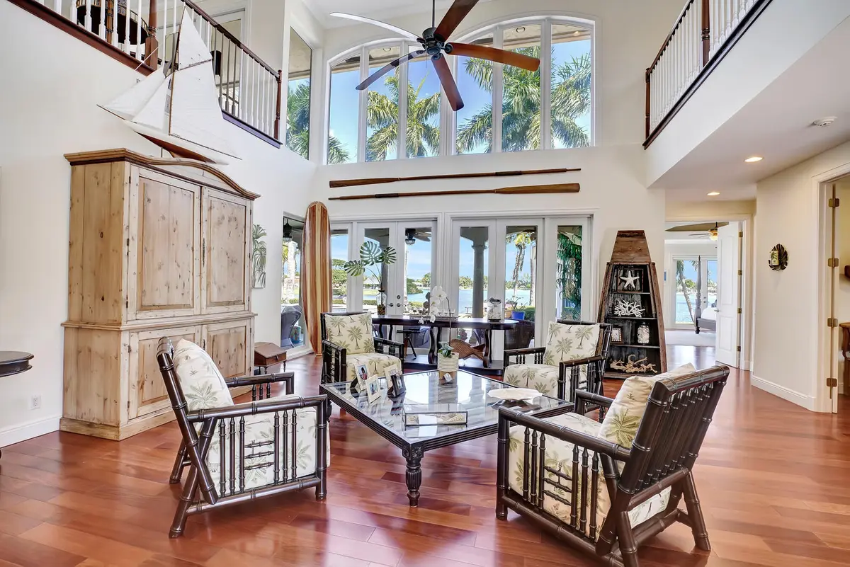 Downstairs living room with lake views at 315 Lake Eden Way, Delray Beach