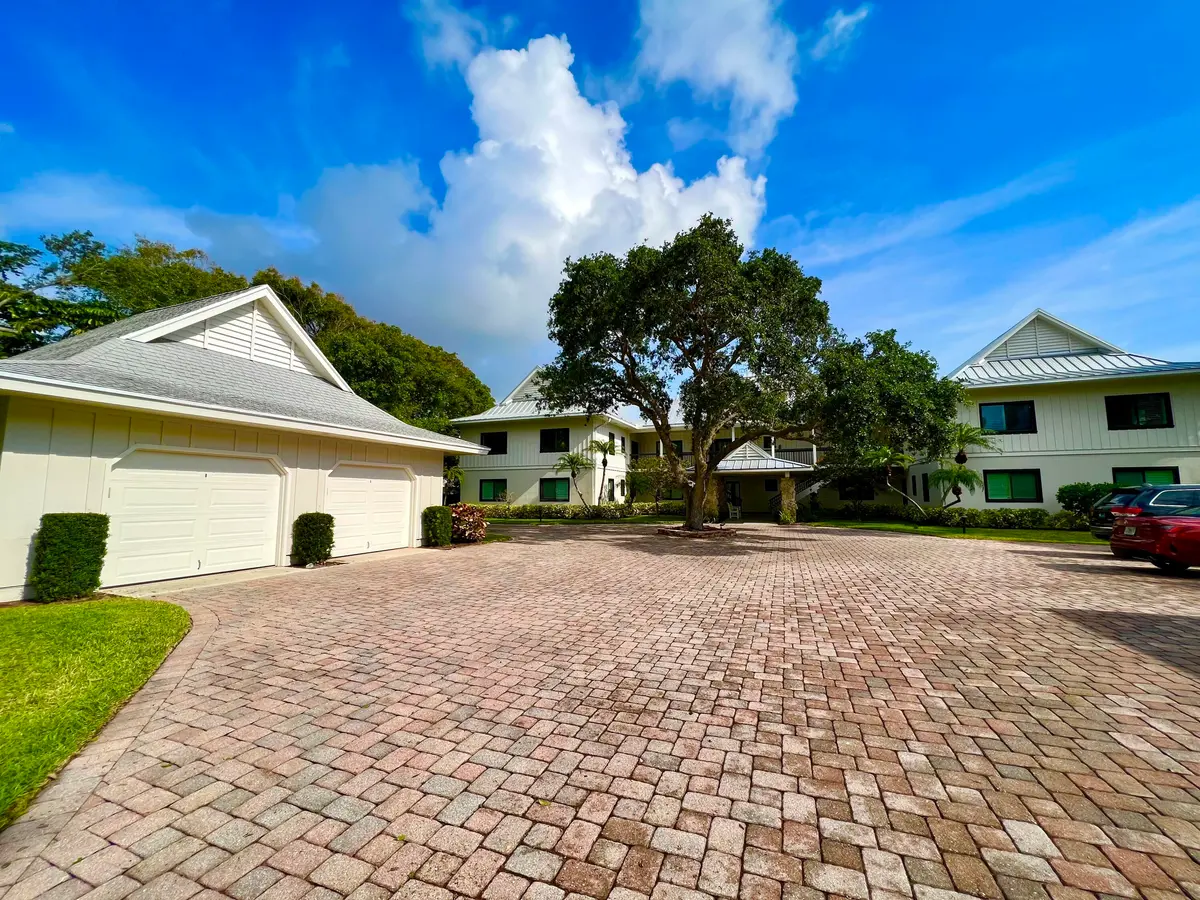 Pavered drive leads you in at 851 Saturn Street F, Jupiter