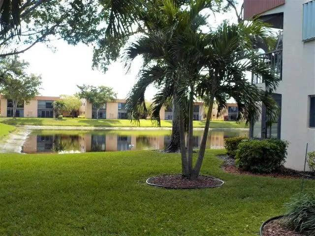 Lovely view as you approach your new hom at 15036 Ashland Lane 69, Delray Beach