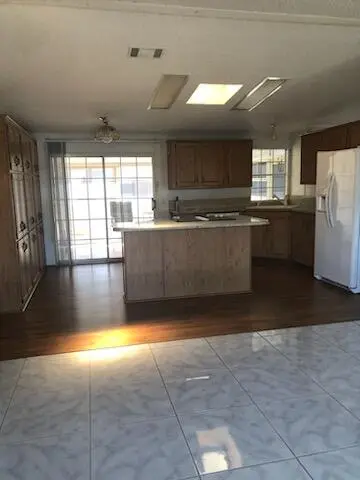 Family/kitchen at 8579 Gallberry Circle, Port St. Lucie