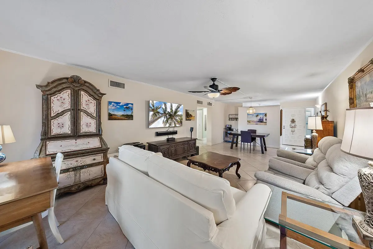 Living room and dining room at 1561 NE 12th Terrace C-14, Jensen Beach