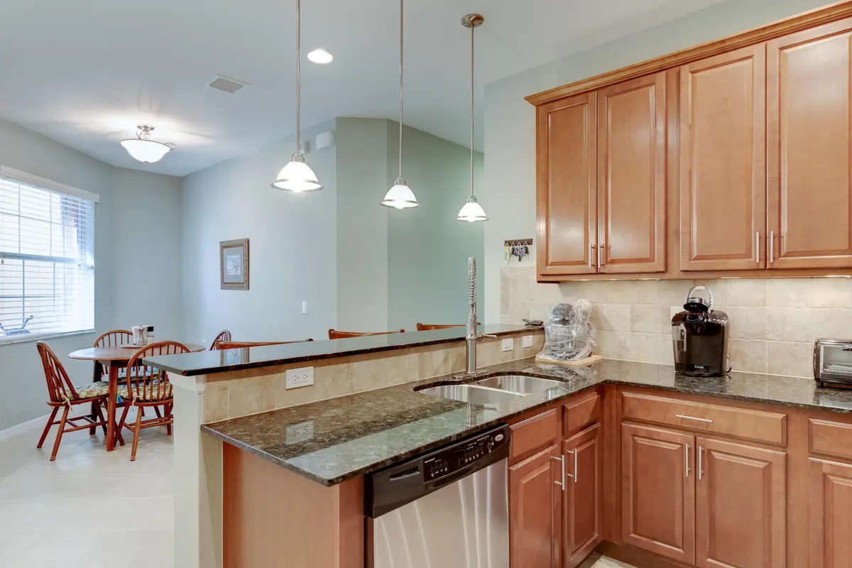 Kitchen towards Dining Room at 6375 Oxford Circle 104d, Vero Beach