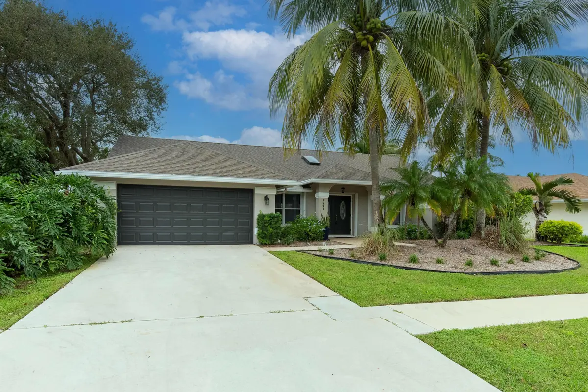Pool home with oversized driveway at 1741 Grantham Drive, Wellington