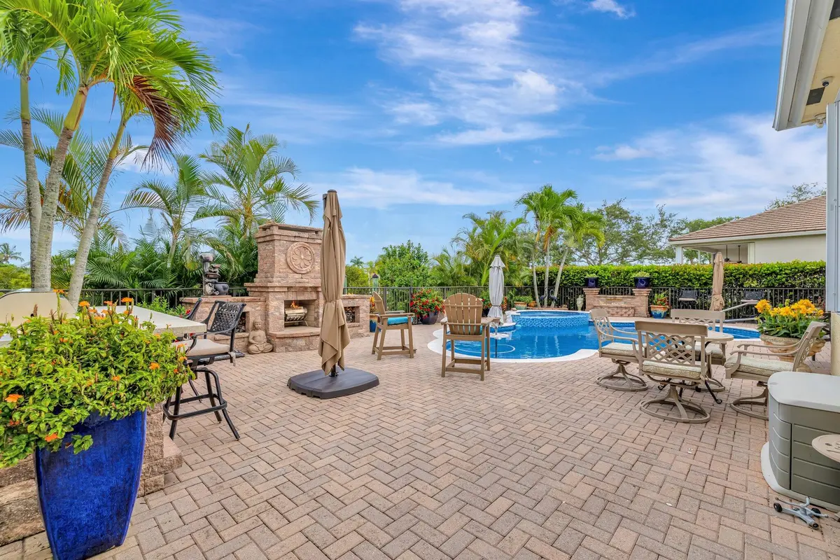 Patio/fireplace/pool /kichen/bar at 699 SW River Bend Circle, Stuart