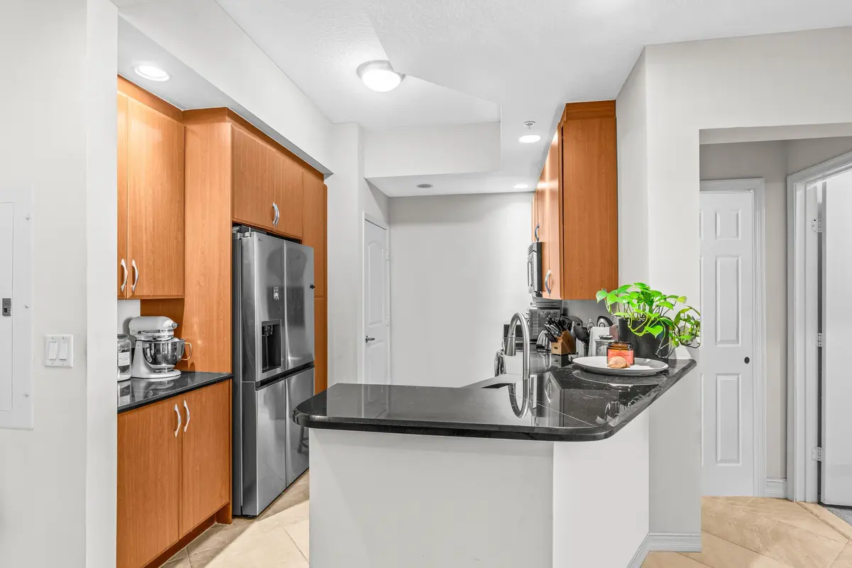 Kitchen with Eat-In Bar at 701 S Olive Avenue 1213, West Palm Beach