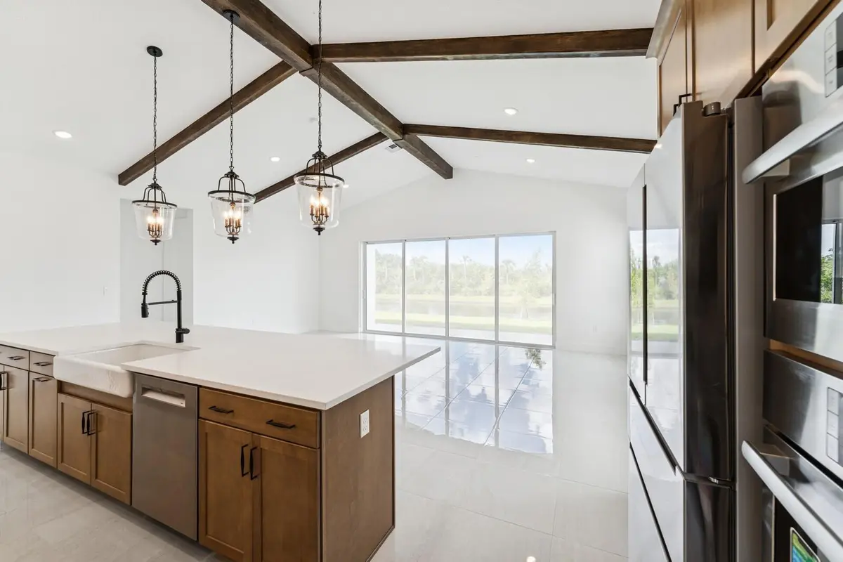 Kitchen, Great Room & Dining Area at 6782 SE Lost Pine Drive 27, Stuart