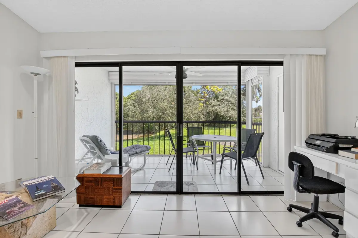 living room looking towards balcony at 5055 Oak Hill Lane 222, Delray Beach