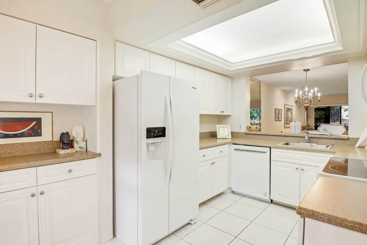 Kitchen w/soffit ceiling, white cabinets at 5121 Oak Hill Lane 416, Delray Beach