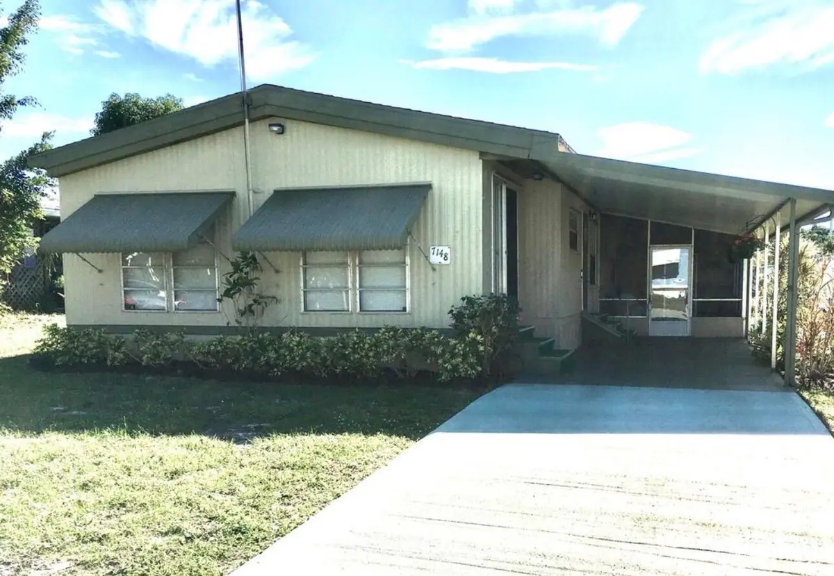 EXTERIOR FRONT at 7148 SE Seahawk Street, Hobe Sound