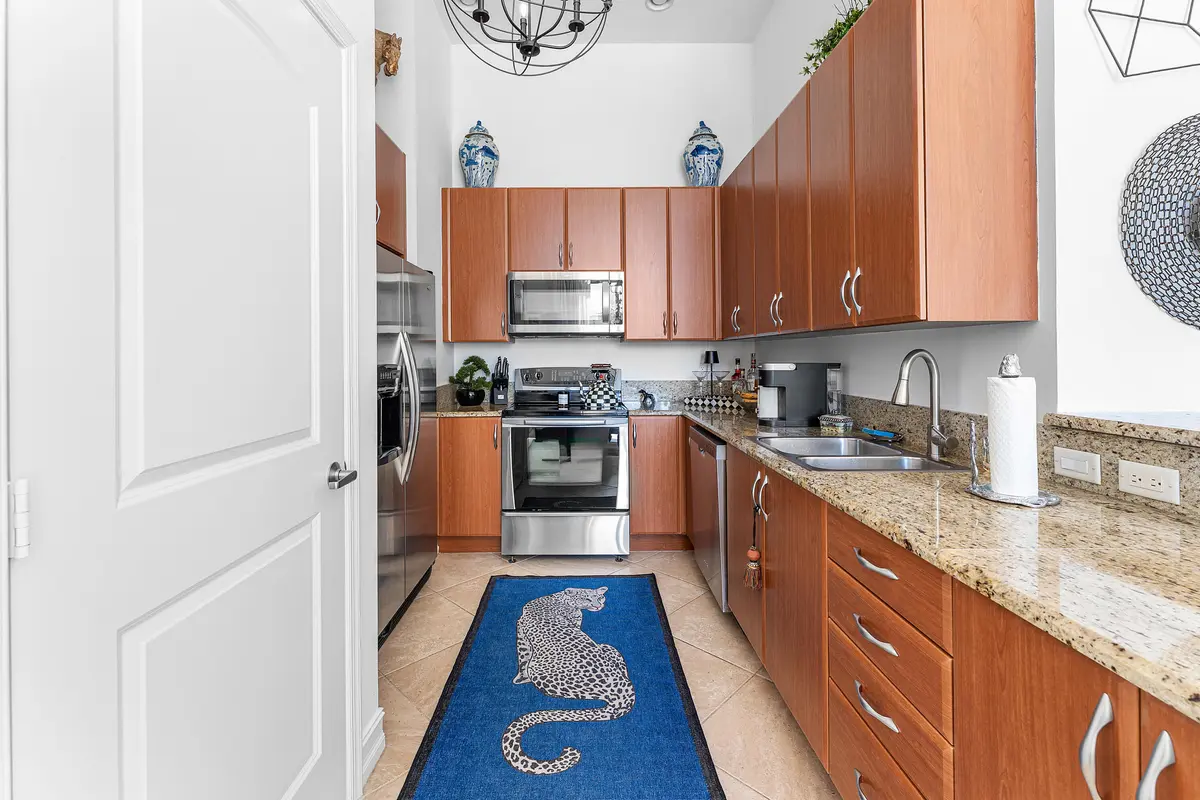 Kitchen w/ Expansive Counters at 701 S Olive Avenue 302, West Palm Beach