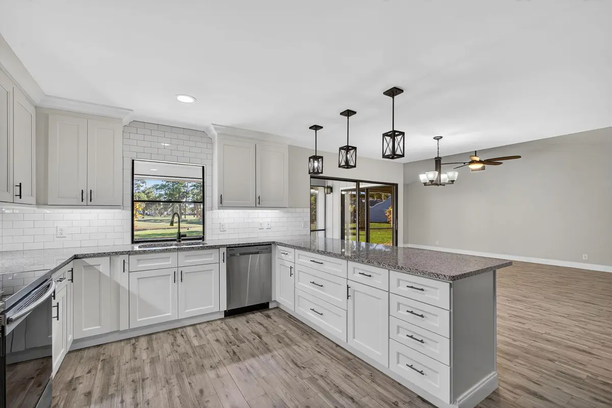 Kitchen opens to great room. at 13302 Touchstone Place, Palm Beach Gardens