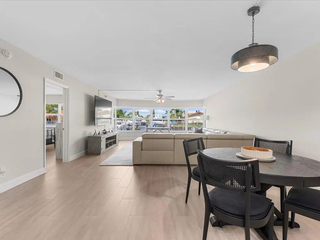 Dining room and Living room at 3111 NE 51st Street 101c, Fort Lauderdale