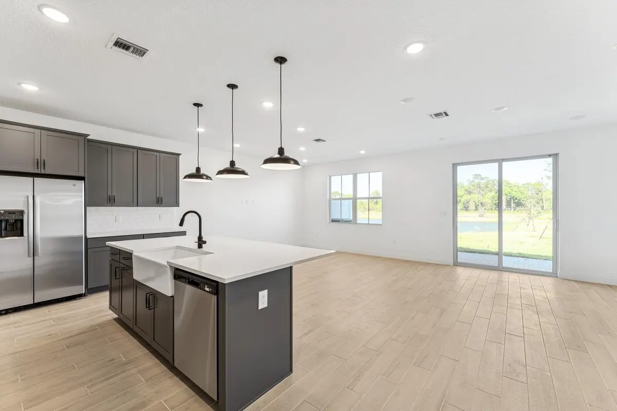 Kitchen, Great Room & Dining Area at 172 SE Birch Terrace 206, Stuart