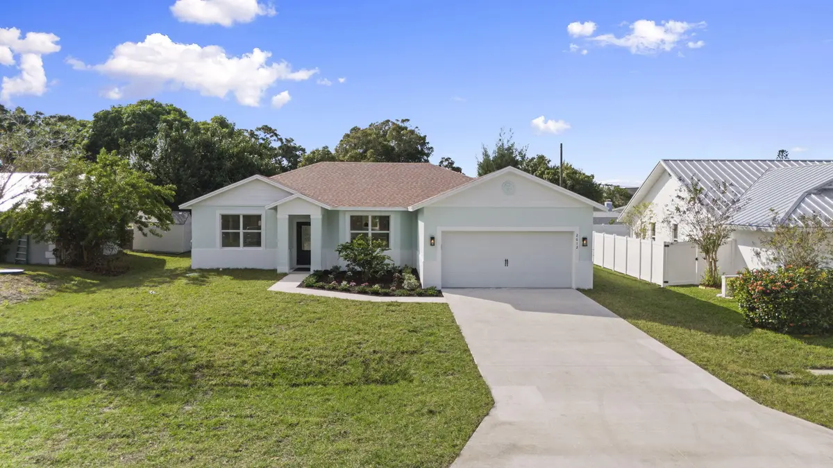 Front elevation with driveway at 2612 SE Solana Lane, Port St. Lucie