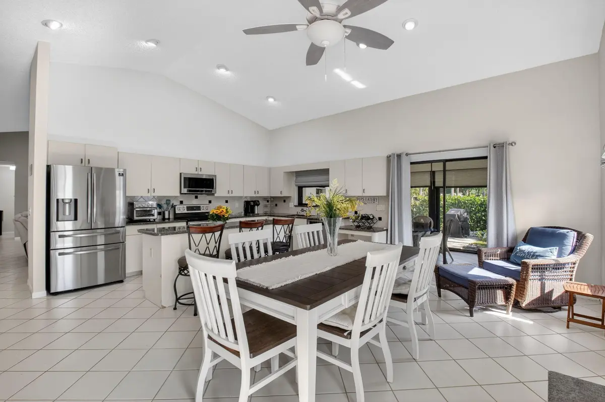KITCHEN WITH ISLAND SEATING AREA at 2905 Riviera Drive, Delray Beach
