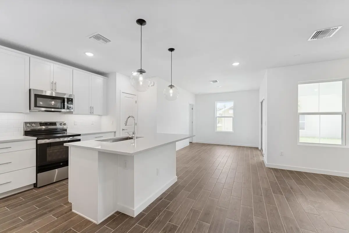 Kitchen, Great Room & Dining Area at 9740 Apollo Avenue 2, Fort Pierce