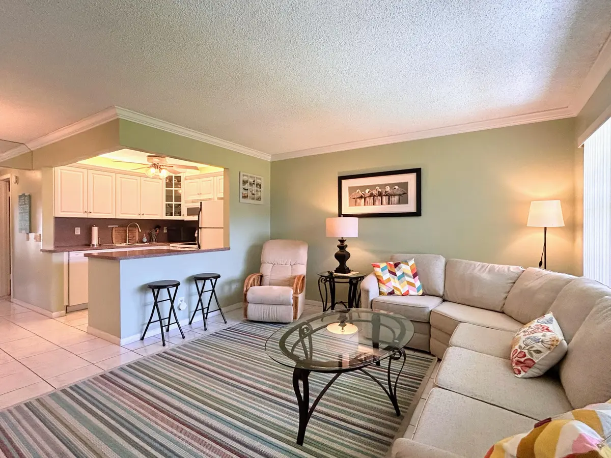 Living Room w/ open kitchen at 450 Horizons E 107, Boynton Beach
