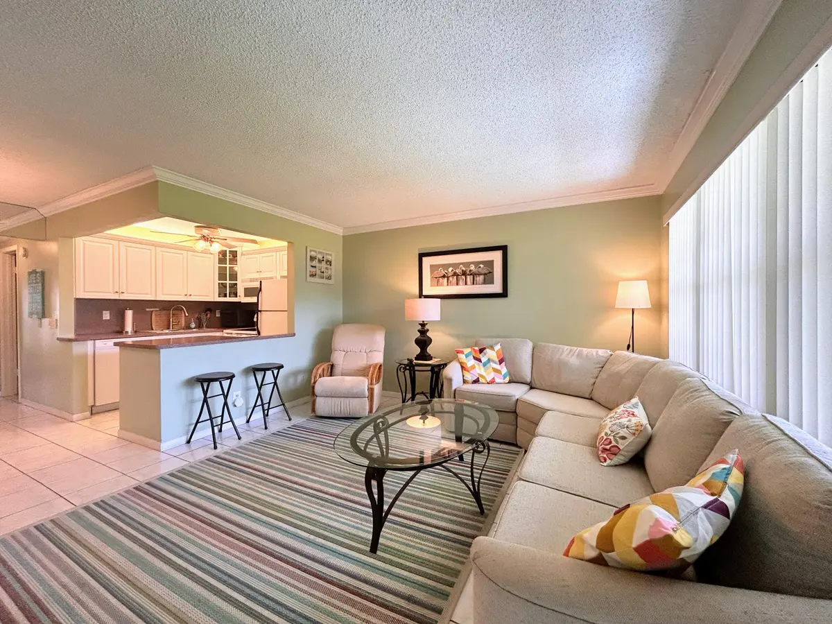 Living Room w/ open kitchen at 450 Horizons E 107, Boynton Beach