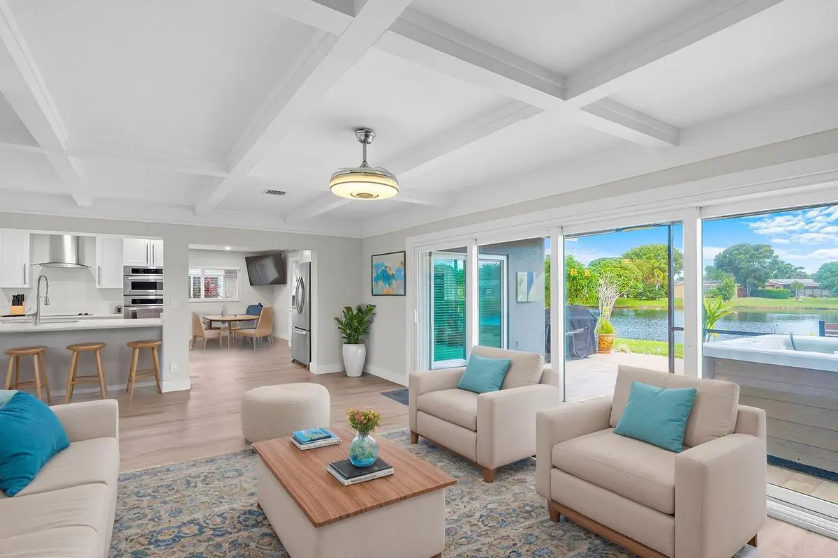 Waterfront Living Room - Virtually Stage at 14624 Country Side Lane, Delray Beach