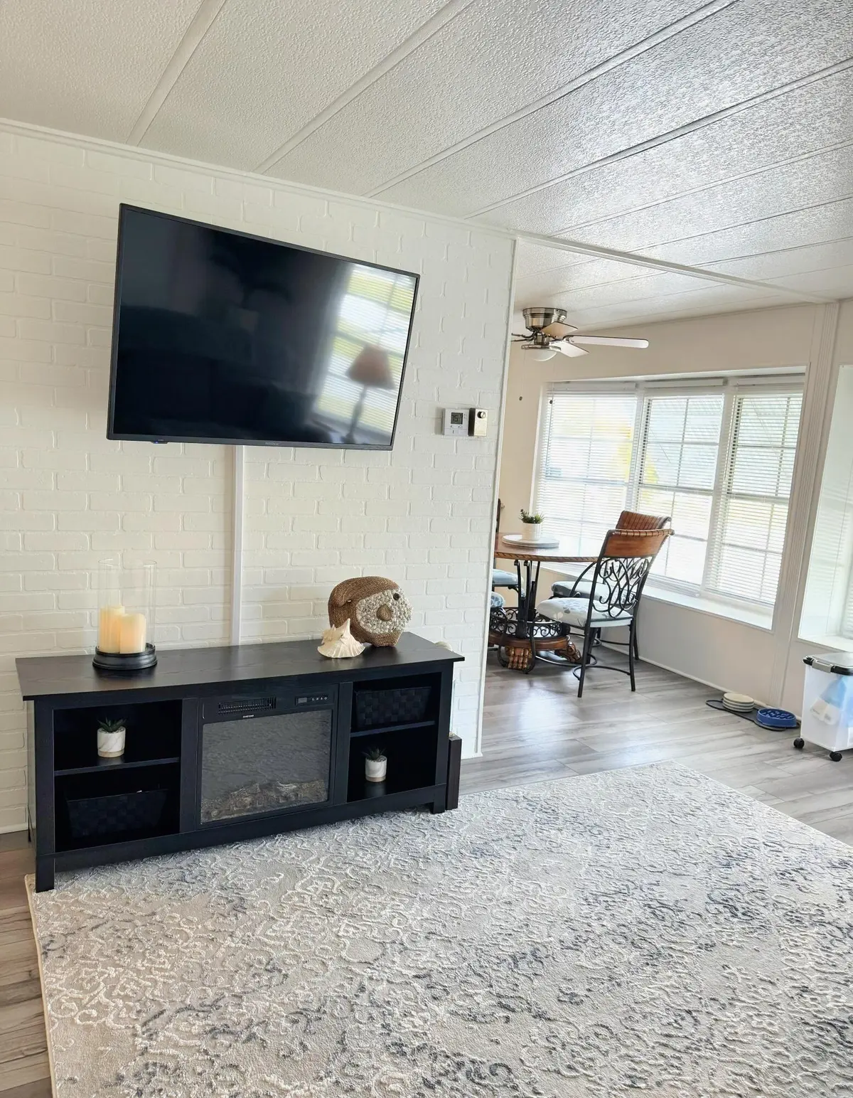 11_Living Room to Kitchen_Fireplace_TV at 10 SE La Mesa, Port St. Lucie