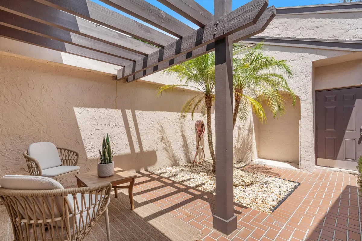 Courtyard Entry/Garage Access at 5272 Fairway Woods Drive 4113, Delray Beach