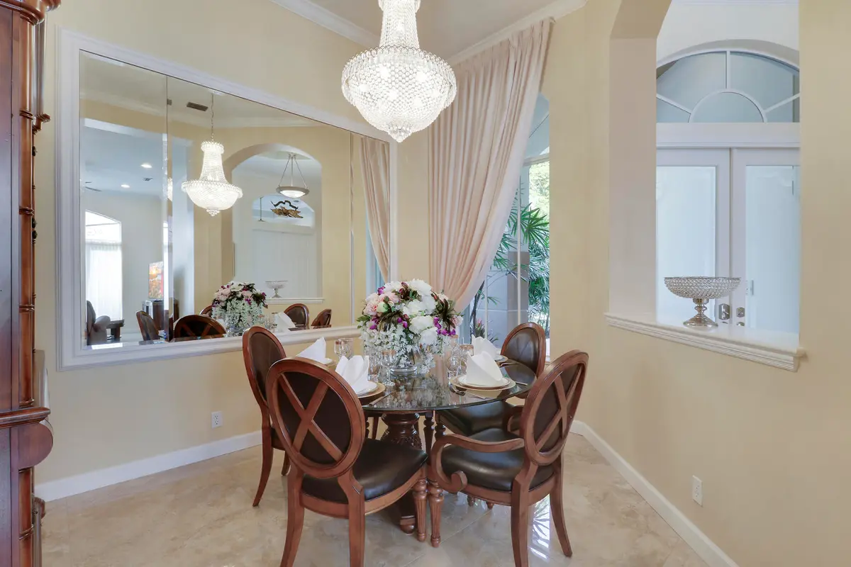 Formal Dining Room with Chandelier at 8216 Cypress Point Road, West Palm Beach