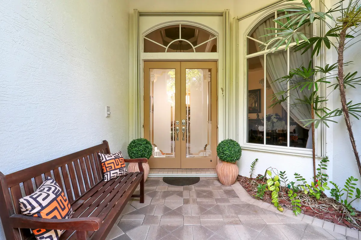 Entrance with Stained Glass Double Doors at 8216 Cypress Point Road, West Palm Beach