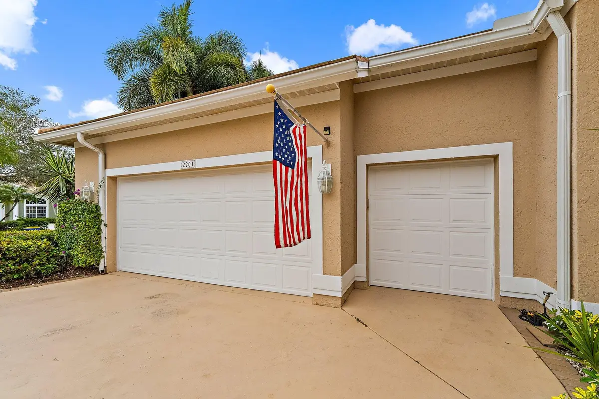 2 car garage plus a golf cart bay at 2201 SW Bradford Place, Palm City
