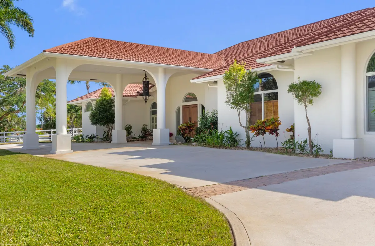 Portico Entry at 15330 Ocean Breeze Lane, Wellington