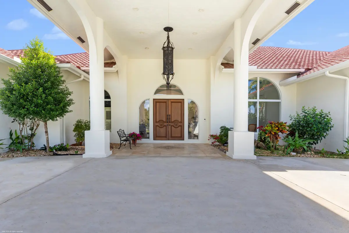 Portico Entry at 15330 Ocean Breeze Lane, Wellington