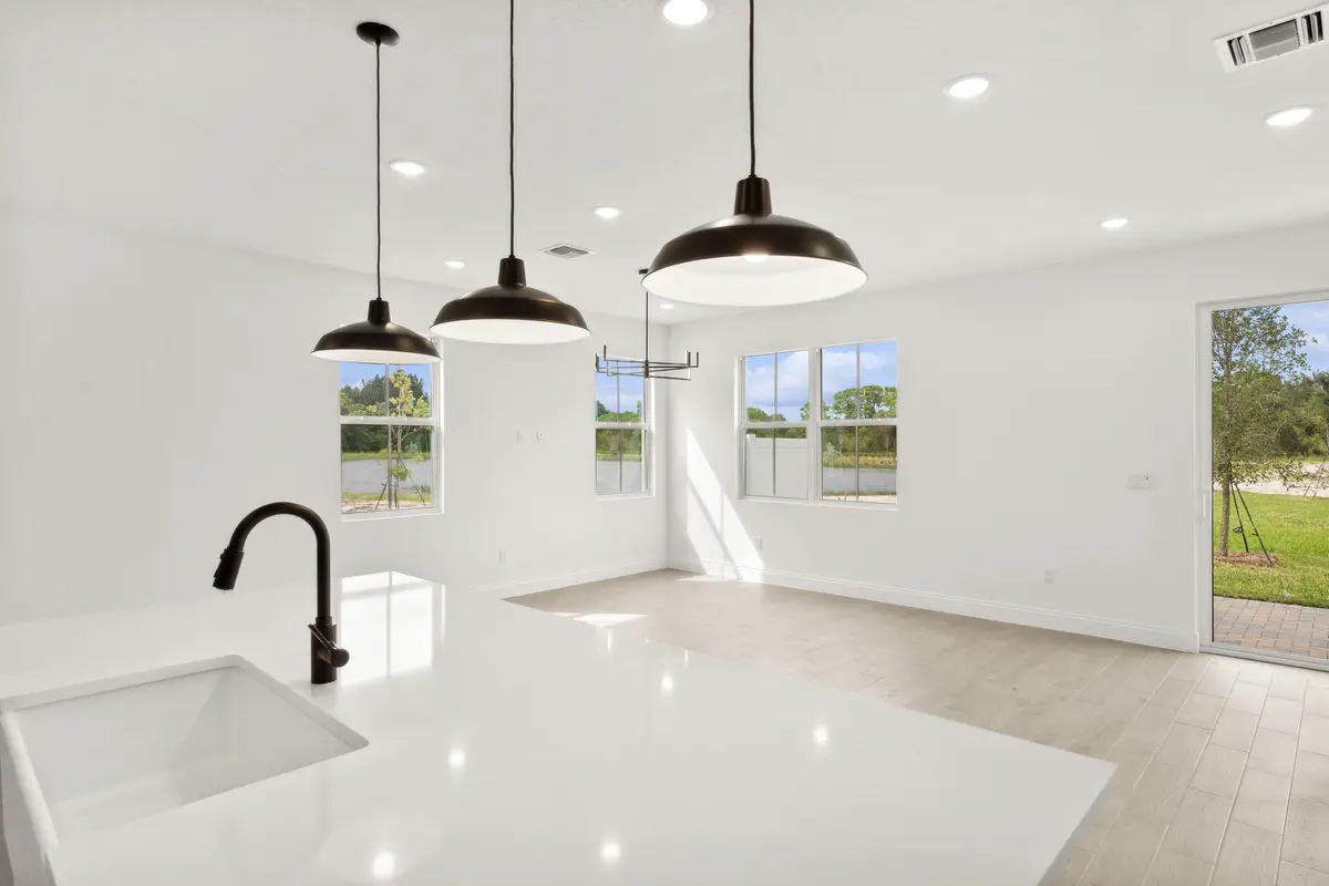 Kitchen, Dining Area & Great Room at 171 SE Birch Terrace 740, Stuart