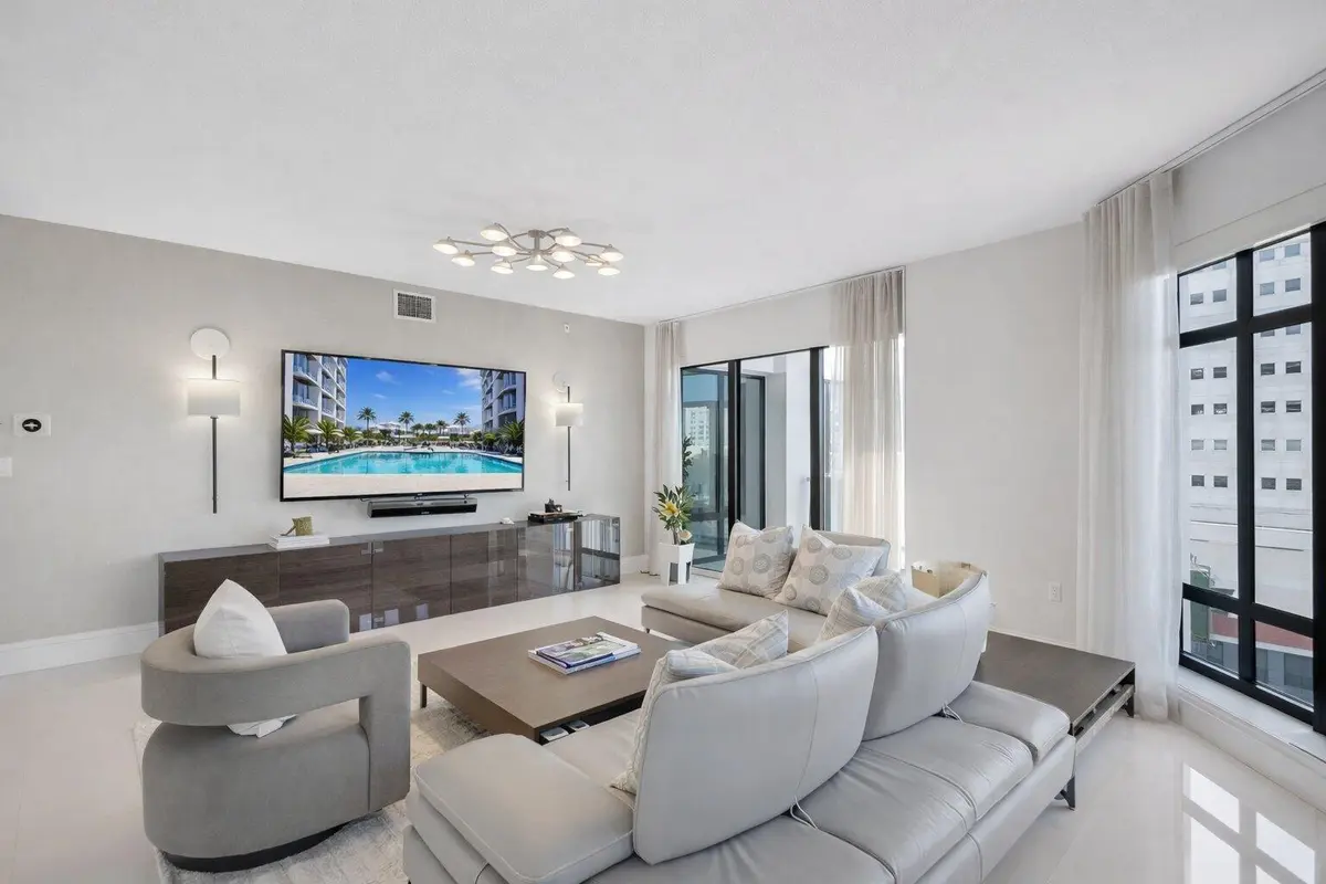 MLS_living_room_tv_pool at 200 E Palmetto Park Road 505, Boca Raton