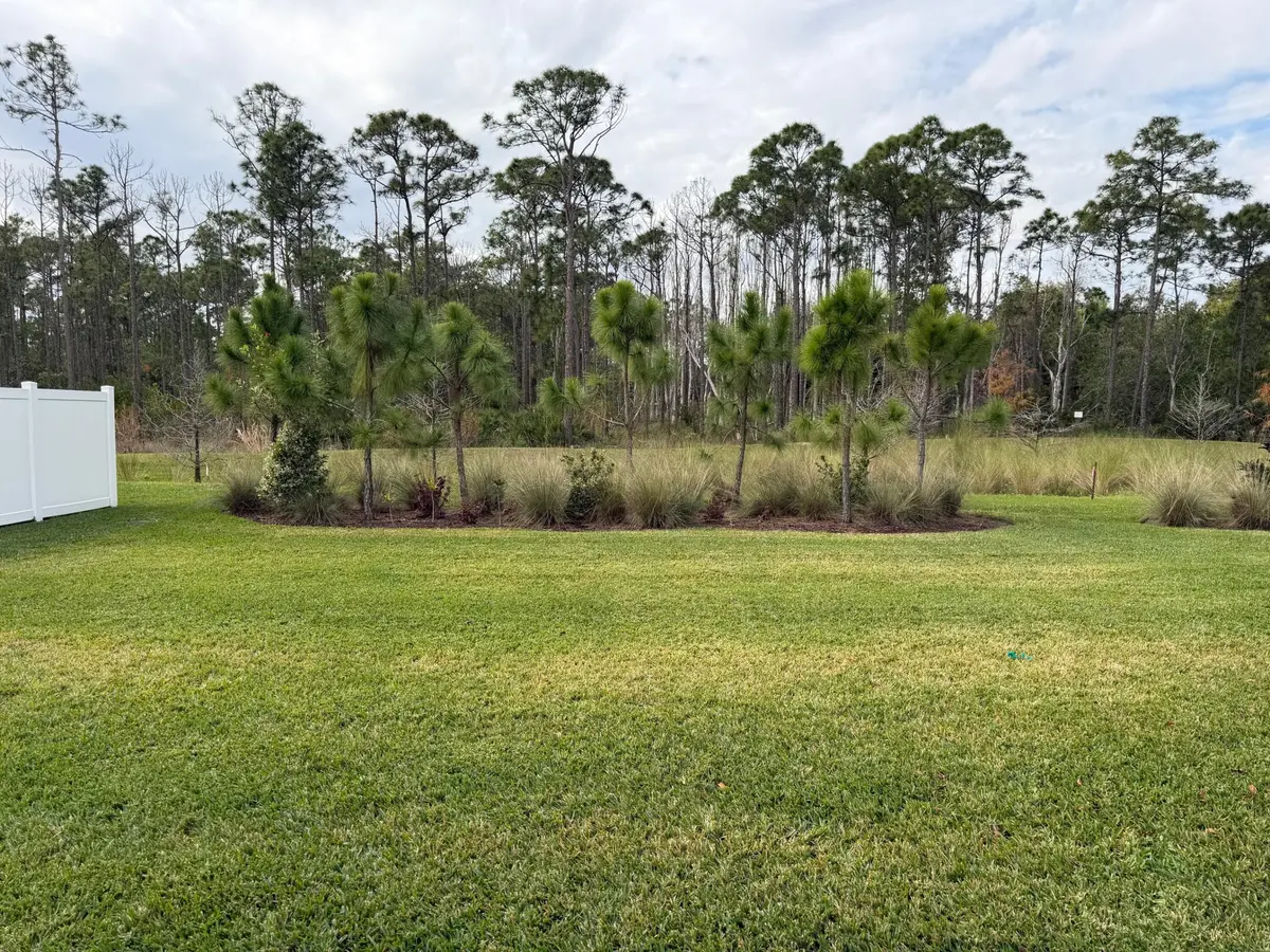 Galen Model backyard preserve view at 6520 SE Park Trace Drive, Stuart