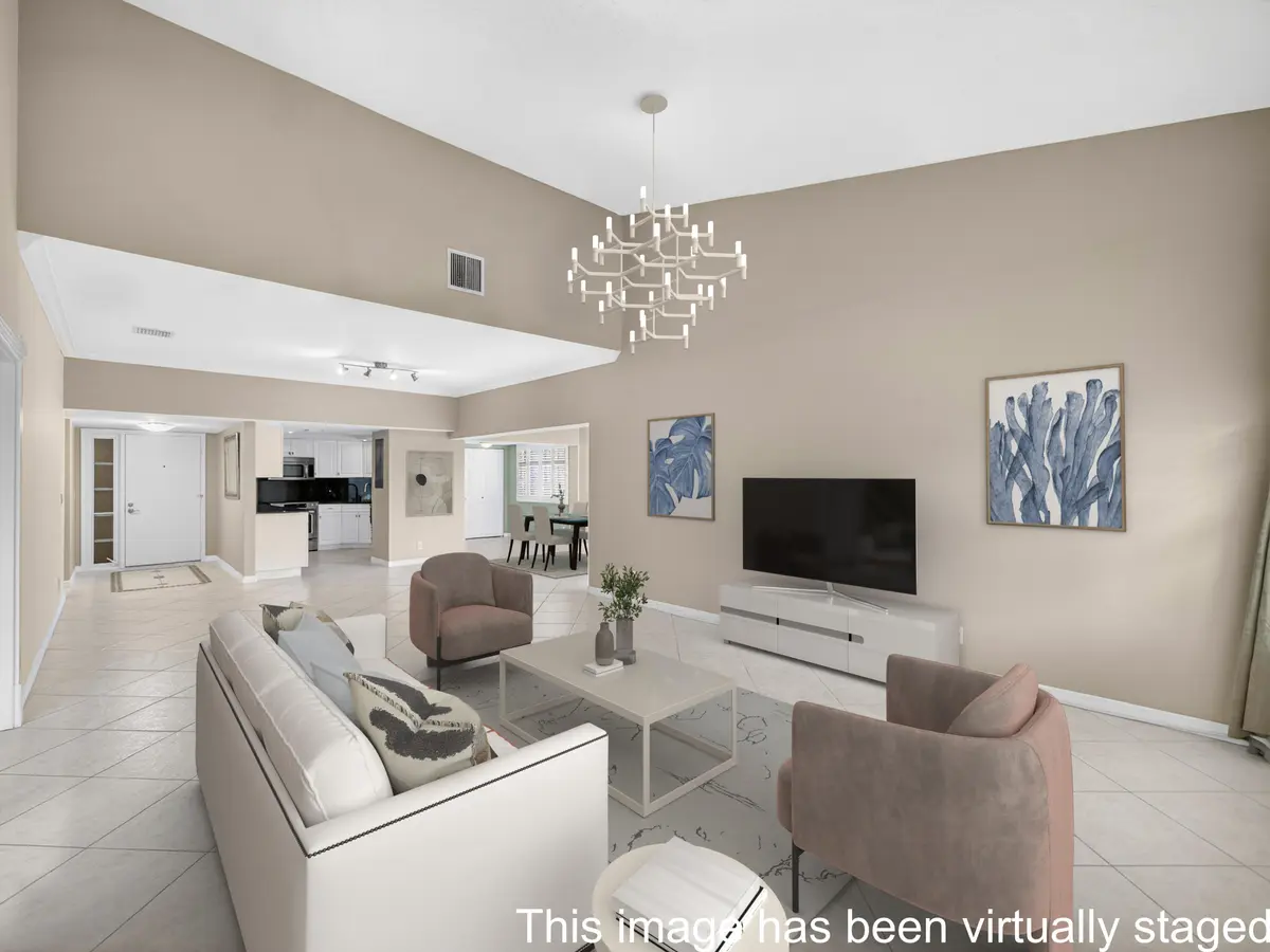 1660 - Living Room _ Dining Area Staged at 1660 Twelve Oaks Way 303, North Palm Beach
