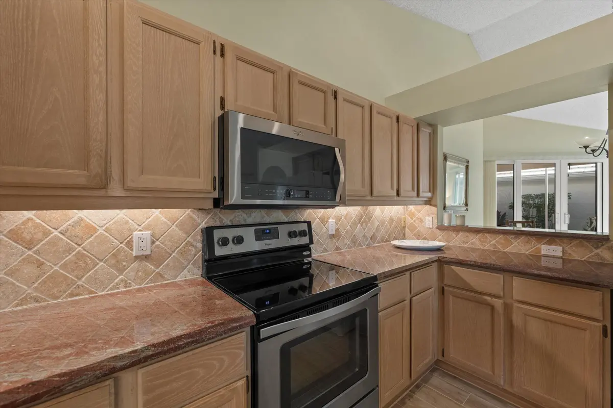 Kitchen overlooking dining area at 1020 Lytham Court, West Palm Beach