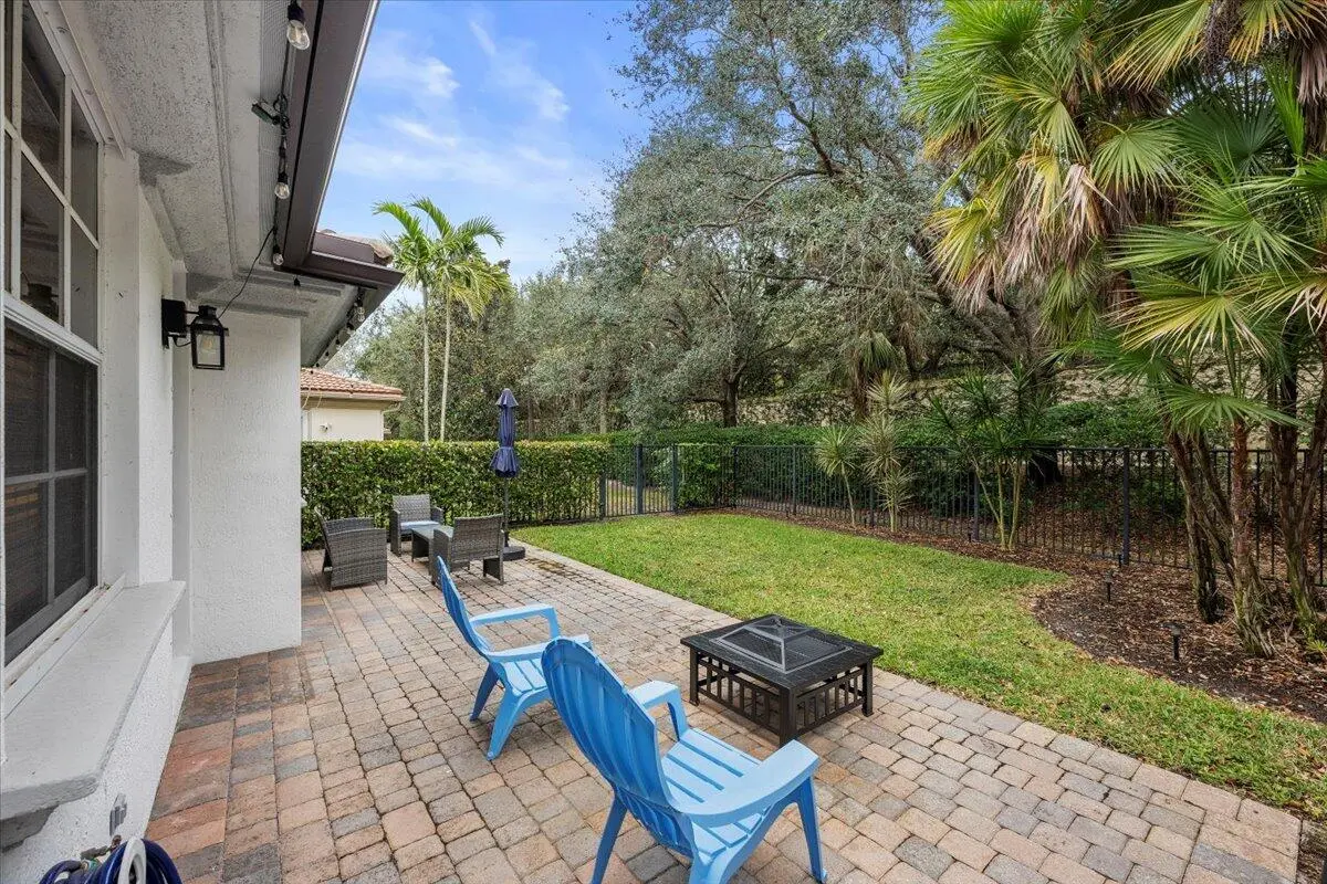 Tree-Lined Backyard at 627 Castle Drive, Palm Beach Gardens