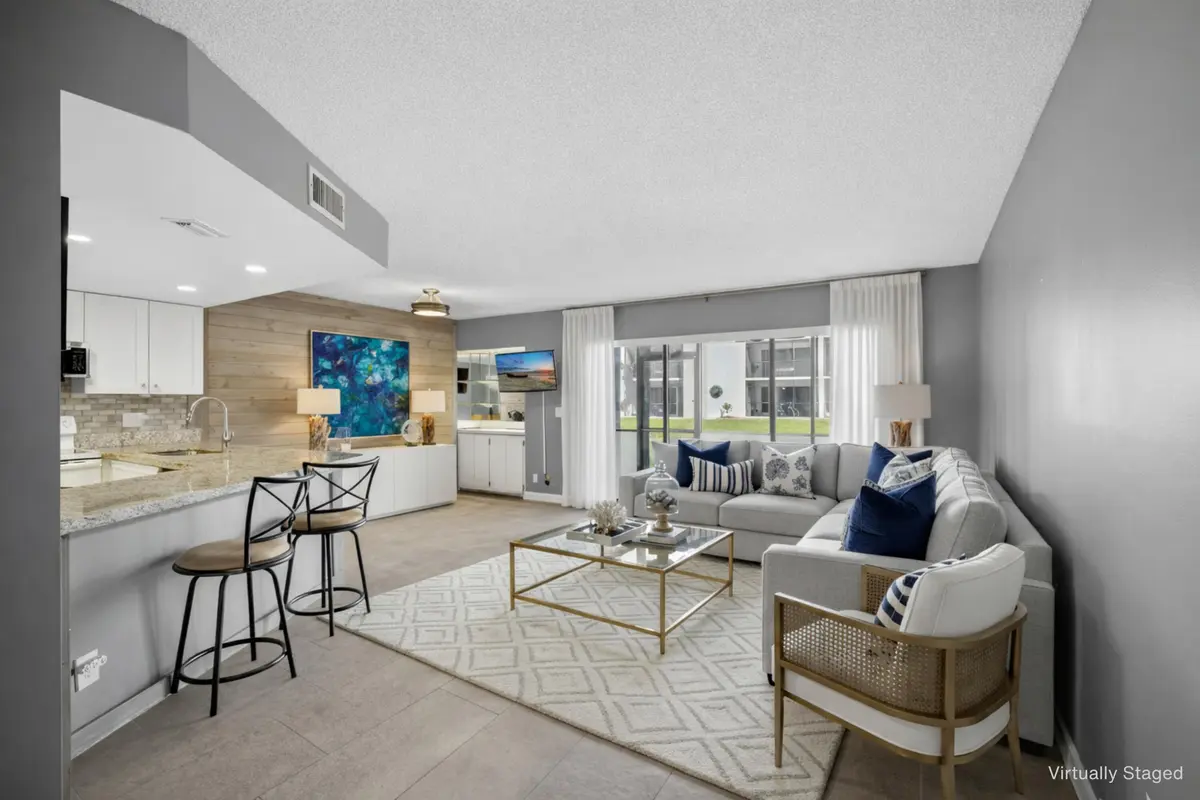 Living Room 1 - Virtually Staged at 1605 S Us Highway 1 D105, Jupiter