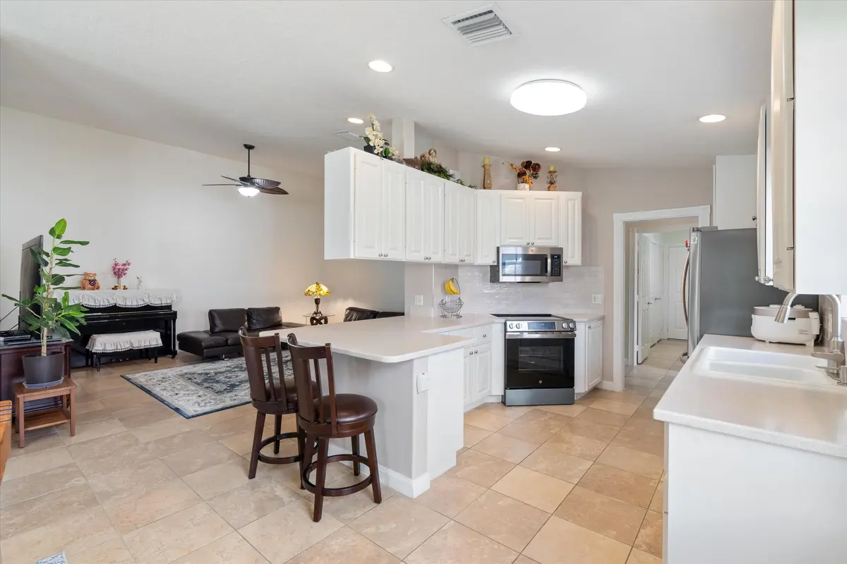 Kitchen and Family room at 8255 Quito Place, Wellington