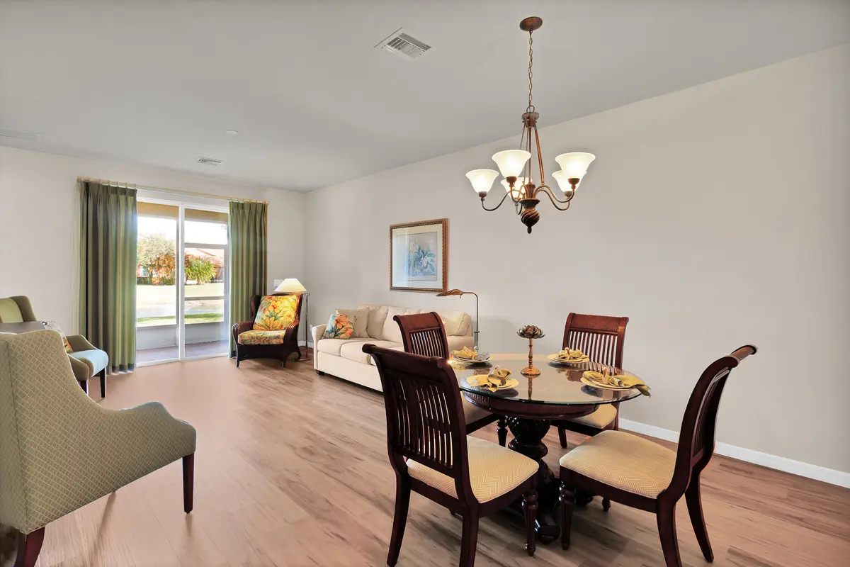 Dining area towards living room at 6380 Oxford Circle 103, Vero Beach