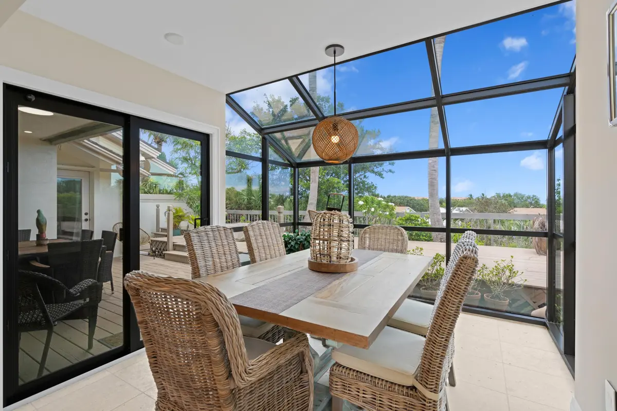 Indoor atrium dining in nature at 197 Ridge Road, Jupiter