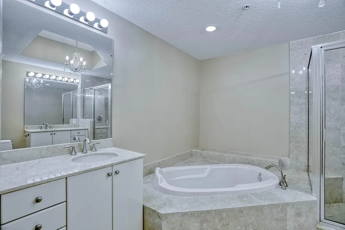 Primary Suite Marble Bath at 701 S Olive Avenue 1202, West Palm Beach