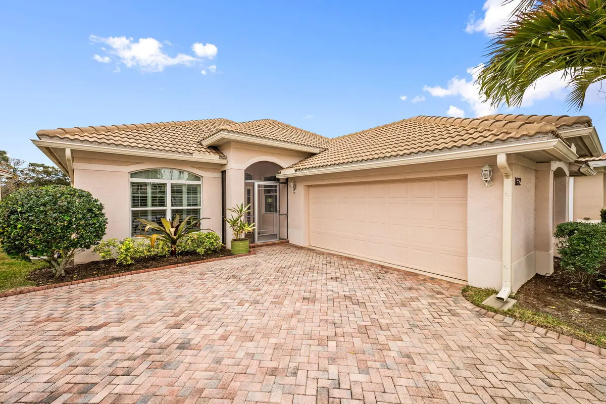 Side loading 2 car garage at 1652 NW Old Oak Terrace, Jensen Beach