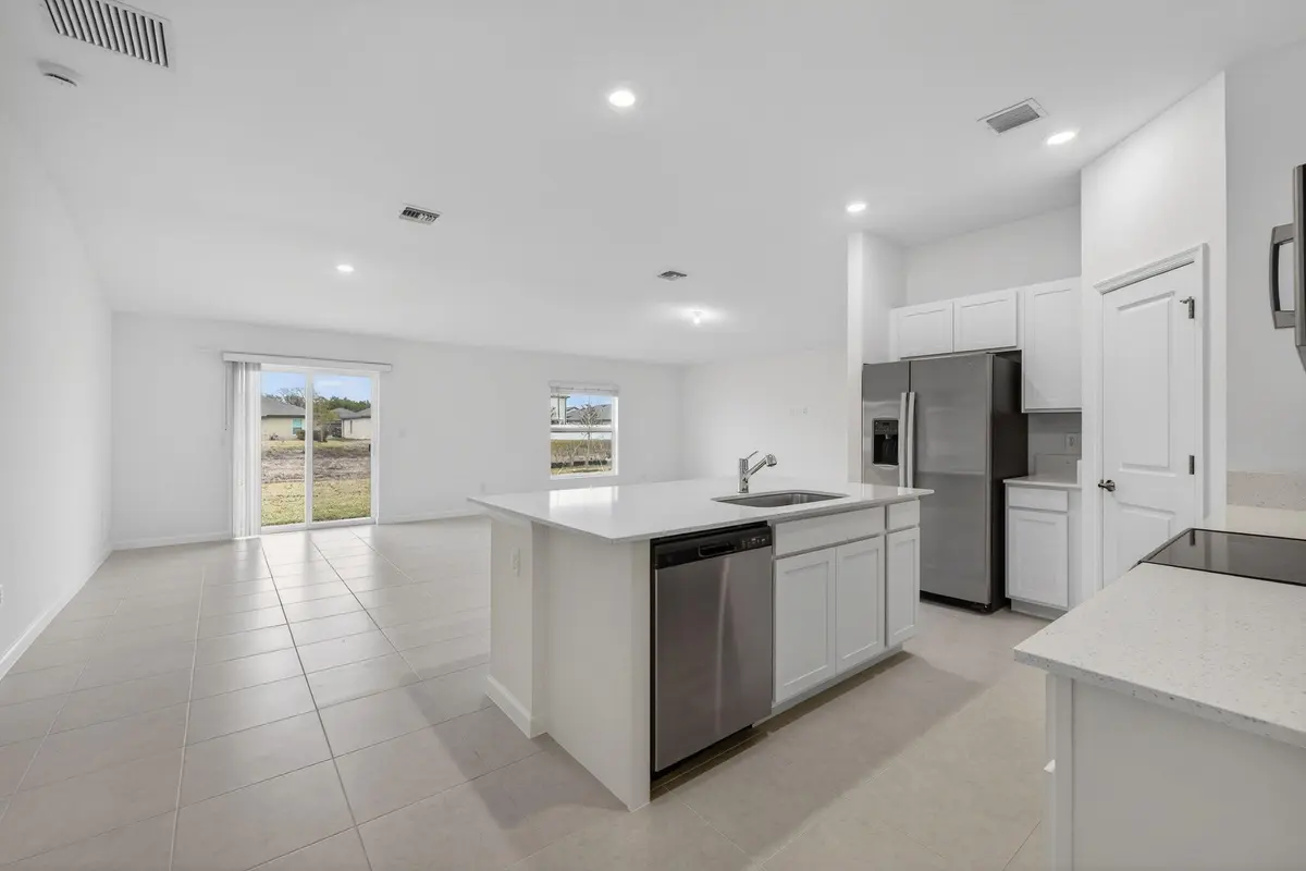 Kitchen view from hallway at 748 Carlyle Way, Fort Pierce