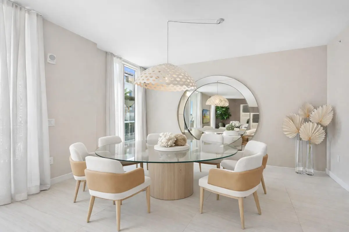 Dining area virtually staged at 210 SE Mizner Boulevard 603, Boca Raton