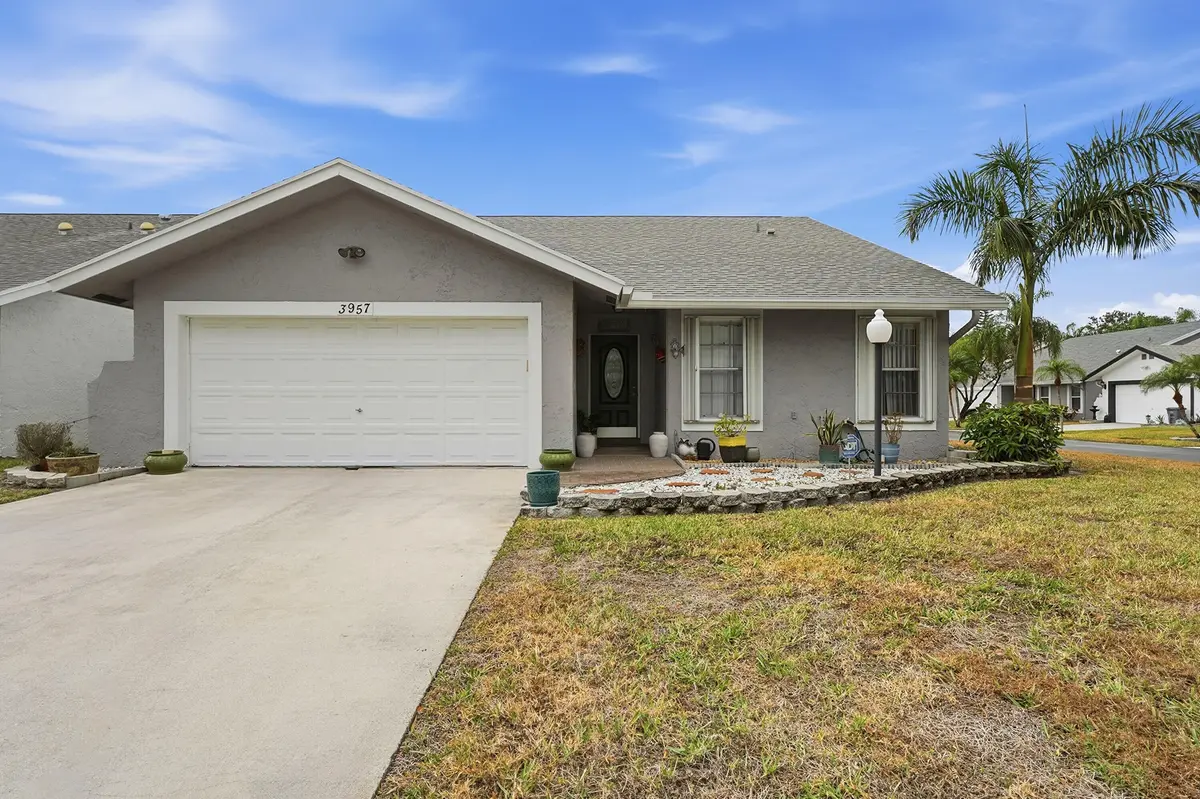 front of home at 3957 Dafilee Circle, West Palm Beach