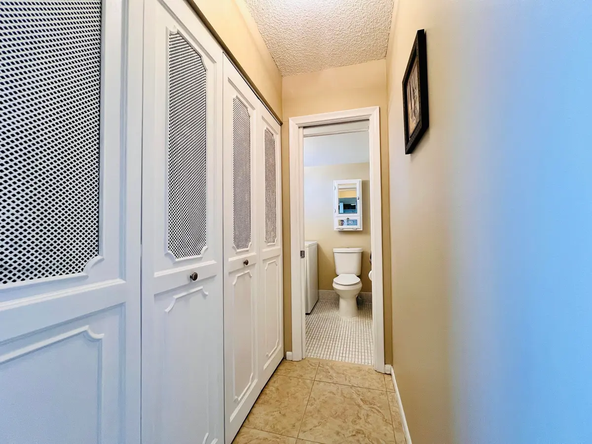 Hall to Guest Bath at 203 Oxford 500, West Palm Beach