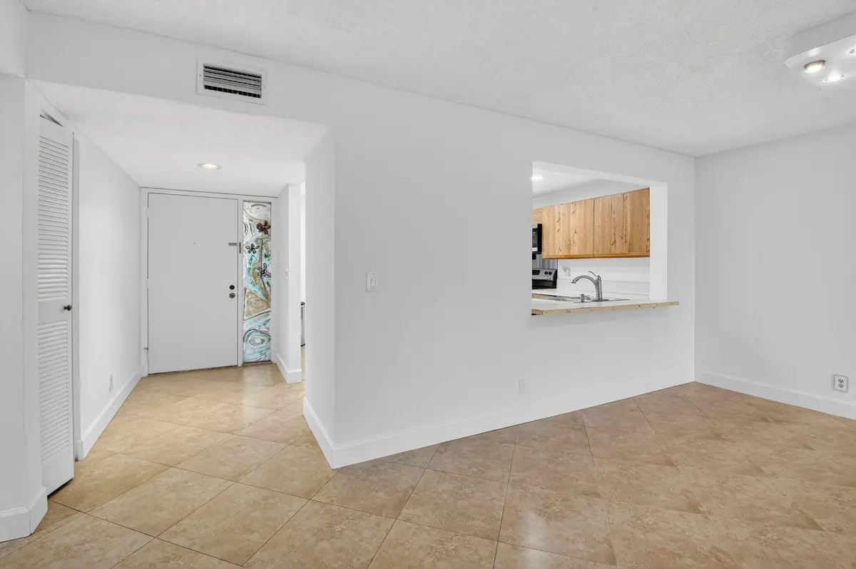 VIEW FROM GREAT ROOM TO ENTRANCE at 5533 Fairway Park Drive 103, Boynton Beach
